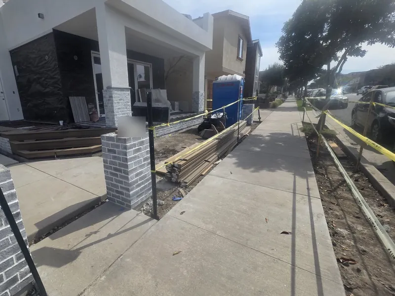 Sidewalk frontage before the fence