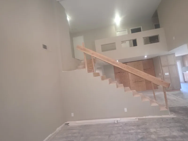 Staircase with a temporary wood guard