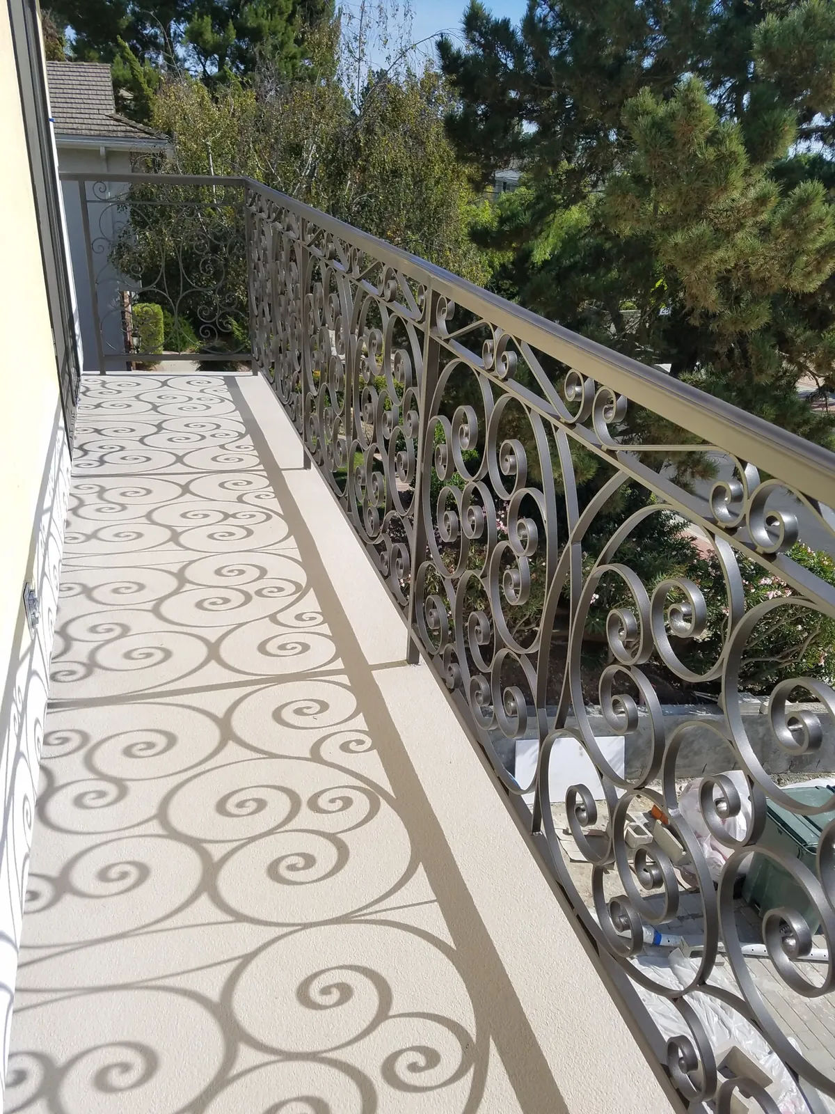 Scrollwork balcony guardrail by ForgePoint Ironworks