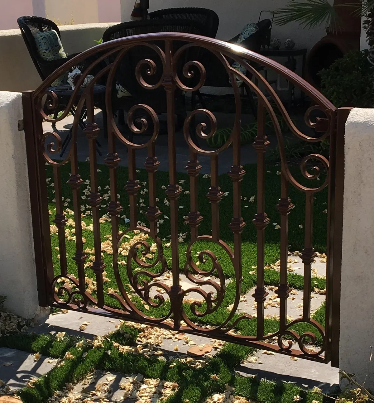 Arched garden gate with scrollwork
