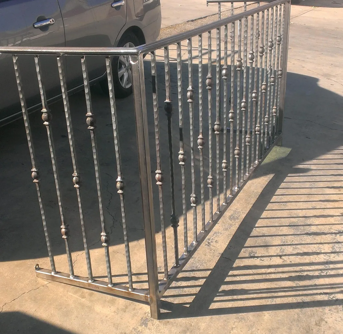 Hammered picket guardrail in raw steel