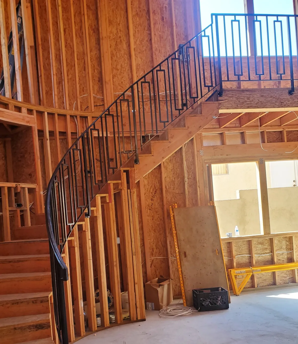 Curved stair rail with geometric pattern