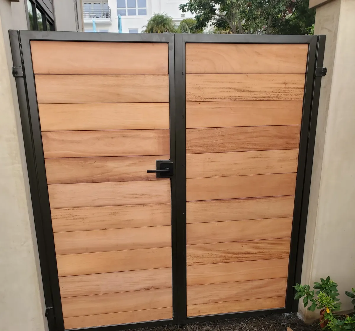 Steel-frame double gate with wood planks