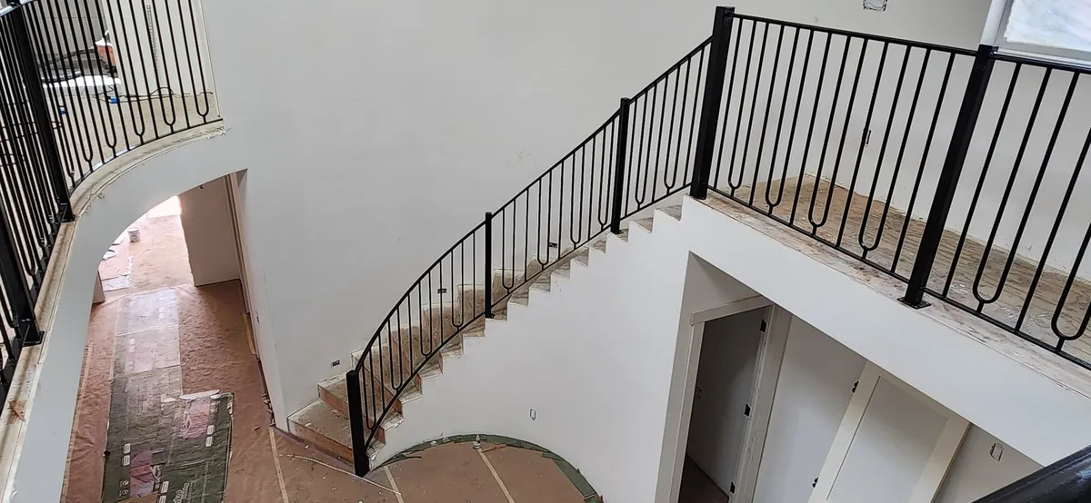 Modern loop-picket curved stair rail