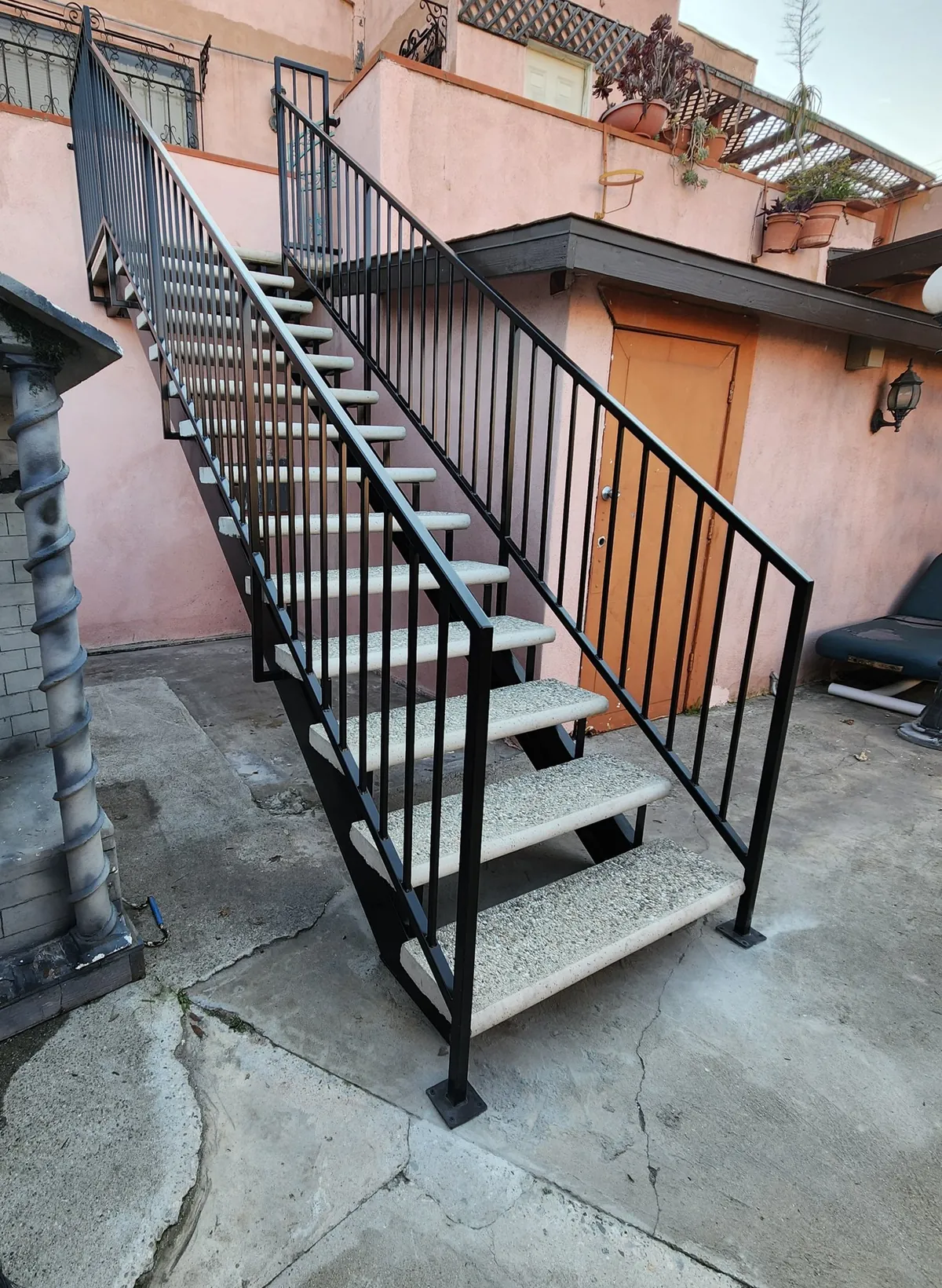 Steel staircase with picket rails