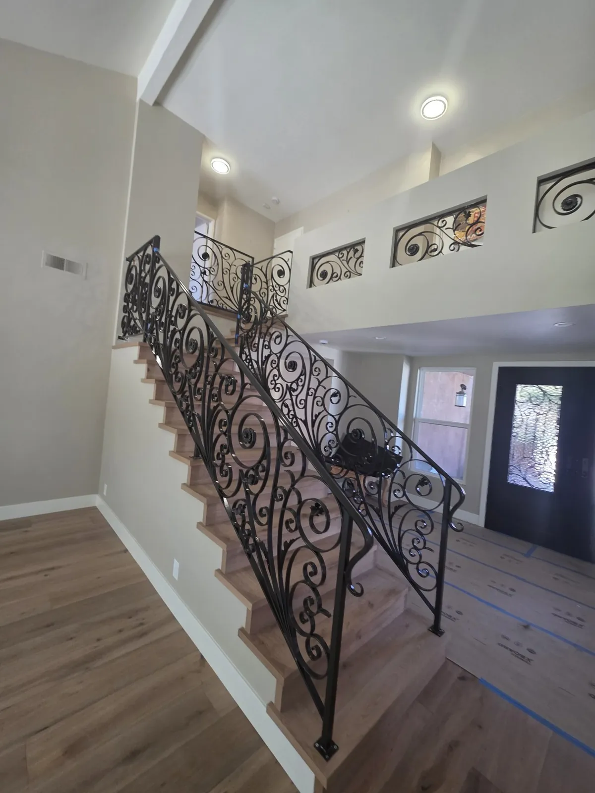 Scrollwork stair railing and loft panels